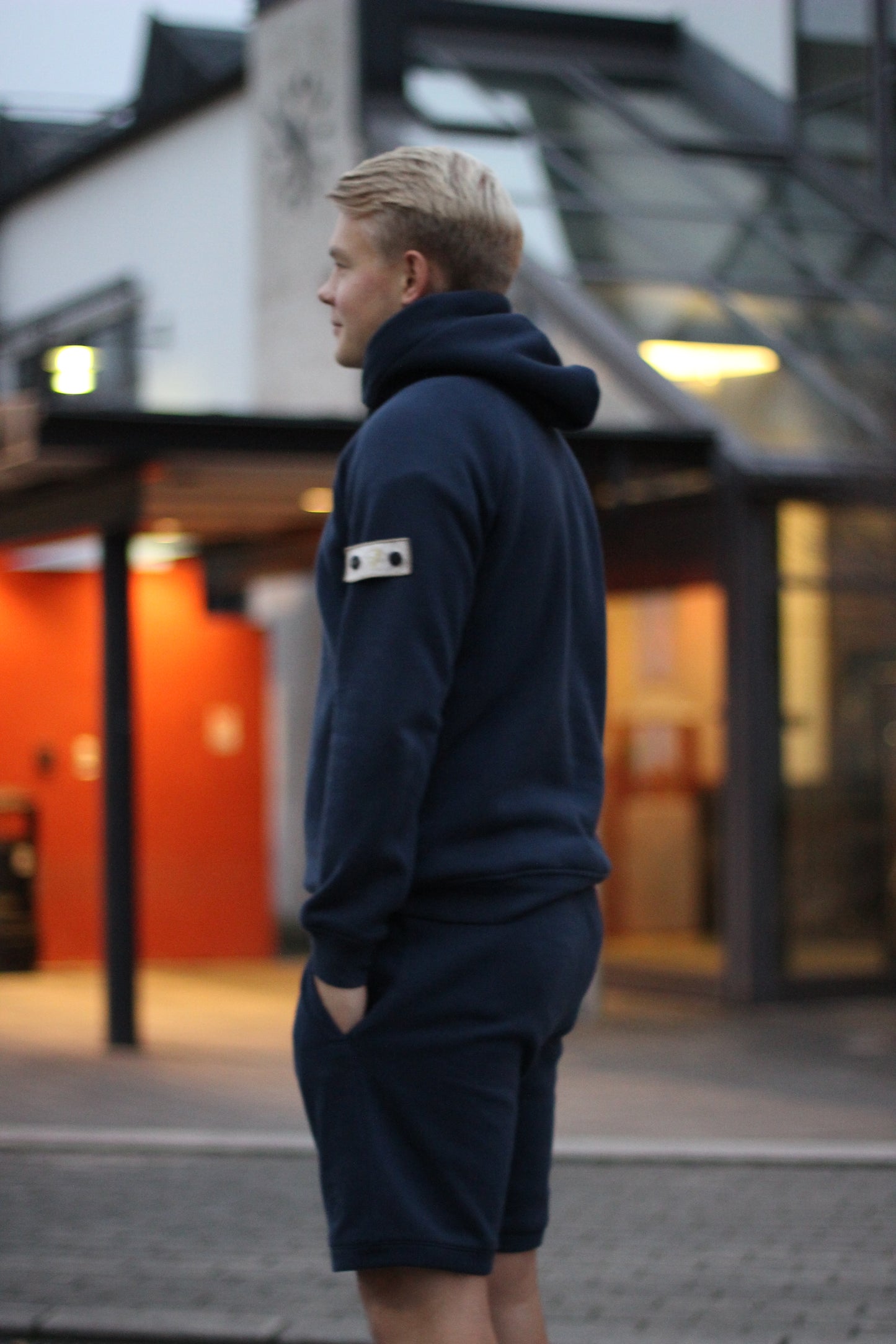 A regular fit navy sweatshort, super soft, with an embroidered badge on the left leg.