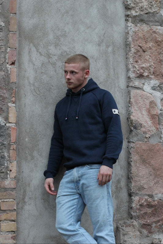 A regular sized Navy hoodie, Regular fit, Super Soft, Badge on left sleeve