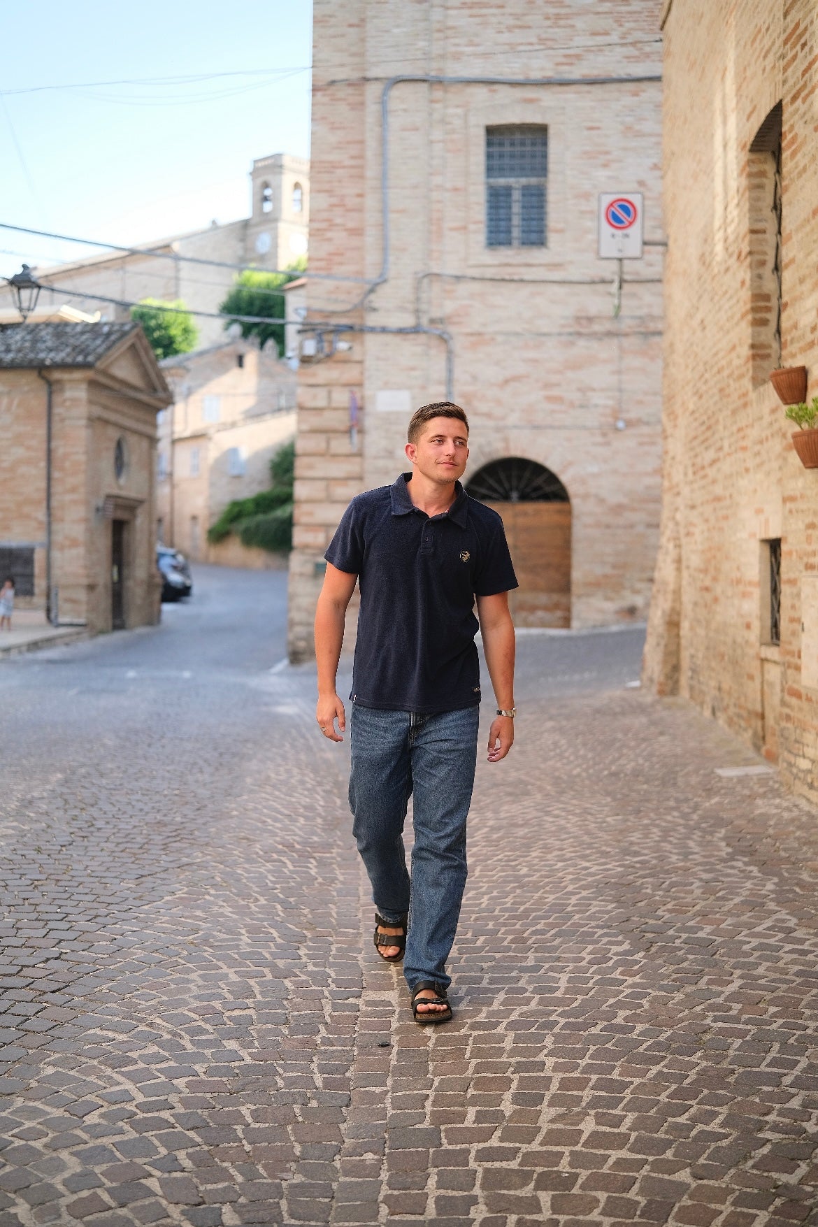 A regular-sized Navy Terry Poloshirt, relaxed fit, super soft, with an ACE logo on the chest.