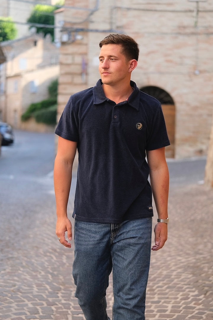 A regular-sized Navy Terry Poloshirt, relaxed fit, super soft, with an ACE logo on the chest.




