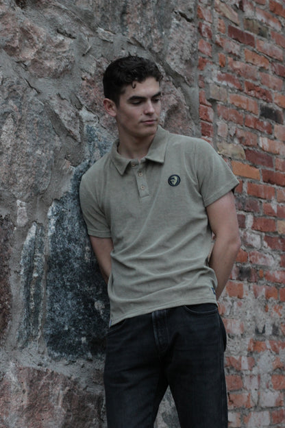 A regular-sized Slate Green Terry Poloshirt, relaxed fit, super soft, with an ACE logo on the chest.