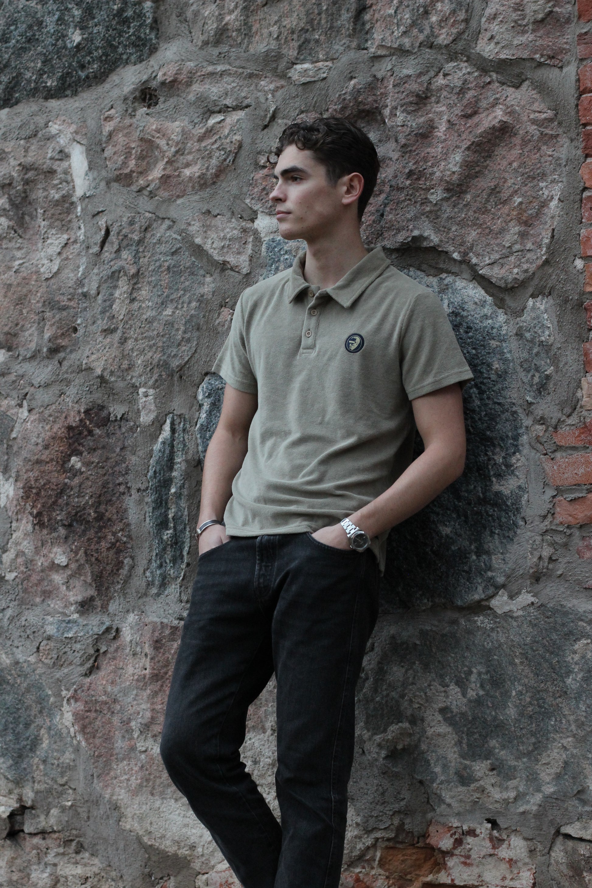 A regular-sized Slate Green Terry Poloshirt, relaxed fit, super soft, with an ACE logo on the chest.