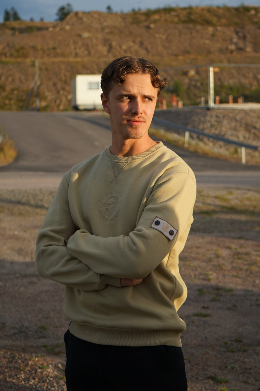 A regular sized Slate green sweatshirt, Regular fit, Super Soft, Badge on left sleeve 