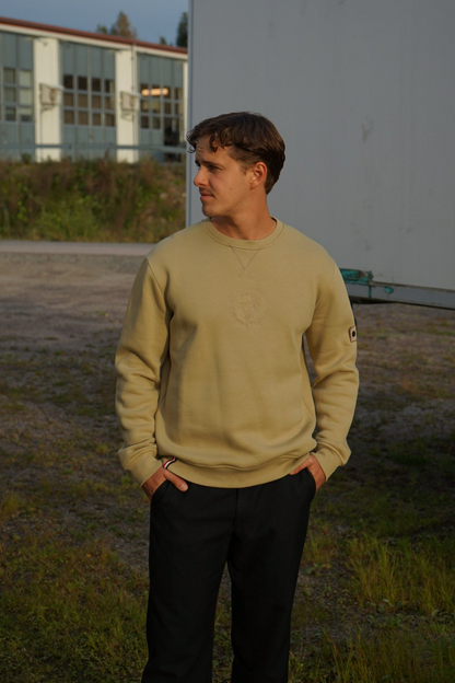 A regular sized Slate green sweatshirt, Regular fit, Super Soft, Badge on left sleeve 